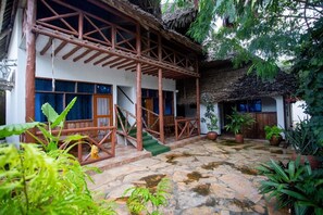Deluxe Room, Garden View | In-room safe, desk, laptop workspace, blackout drapes
