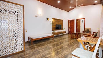 Desk, iron/ironing board, bed sheets