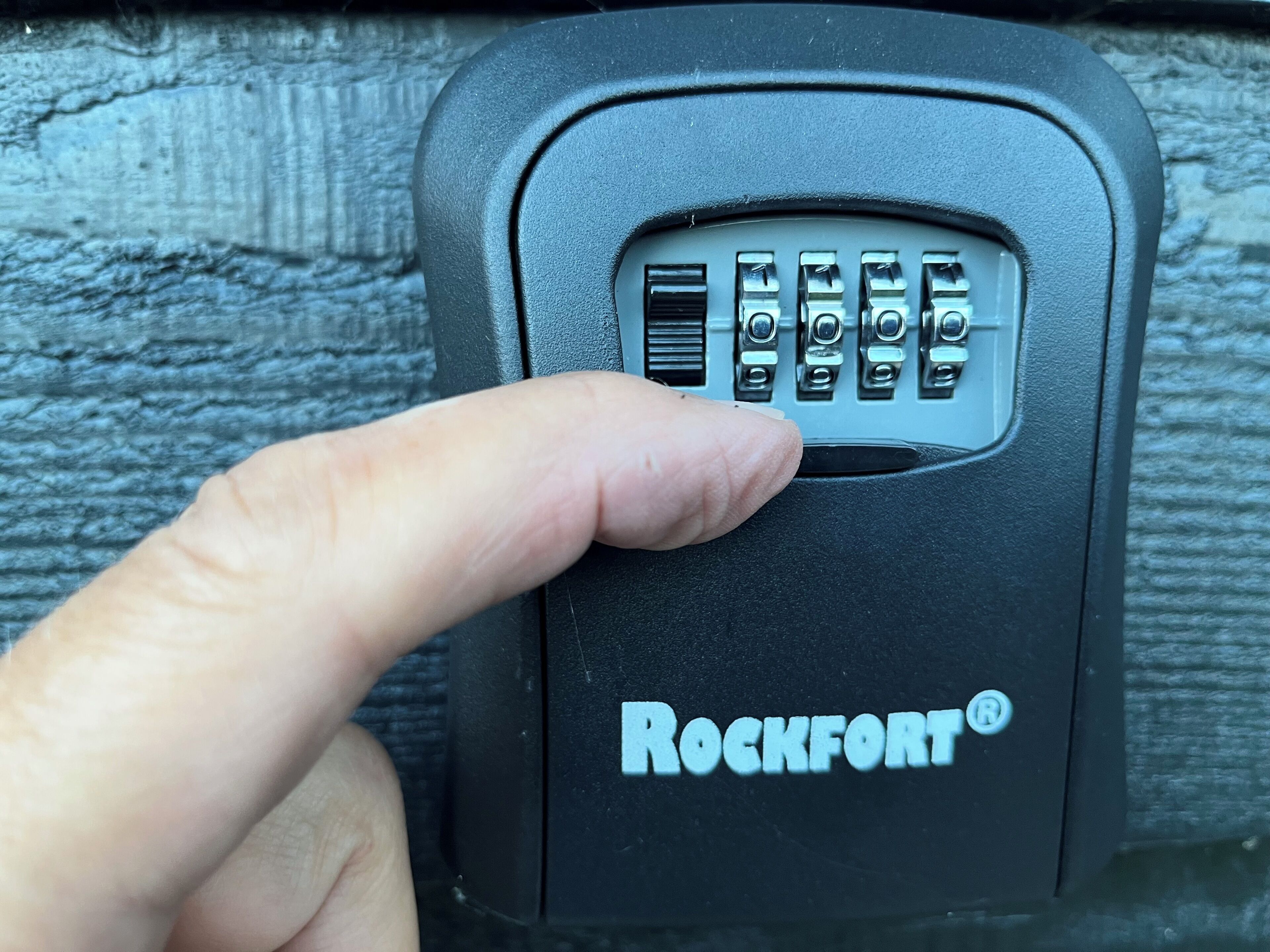 A close-up of a Rockfort® car lock with a keypad.
