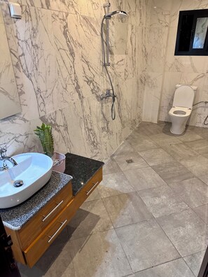 Shower, hair dryer, towels, soap