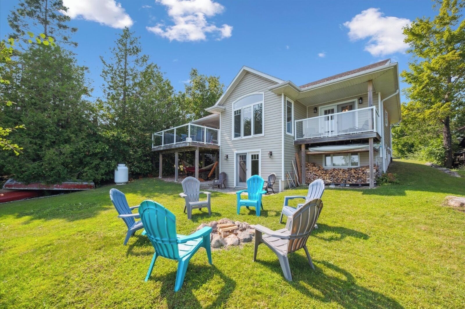 Gather around the firepit for cozy evenings under the stars, with stunning views of the lake and the warm glow of your private retreat behind you.