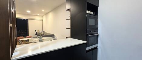 Coffee/tea maker, fridge, microwave, oven