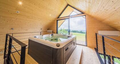 Maison contemporaine avec vue imprenable et spa.
En haut du paradis
