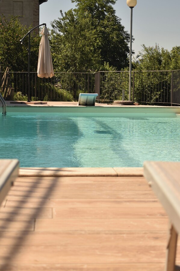 Outdoor pool, open 9:30 AM to 7:30 PM, pool umbrellas, sun loungers