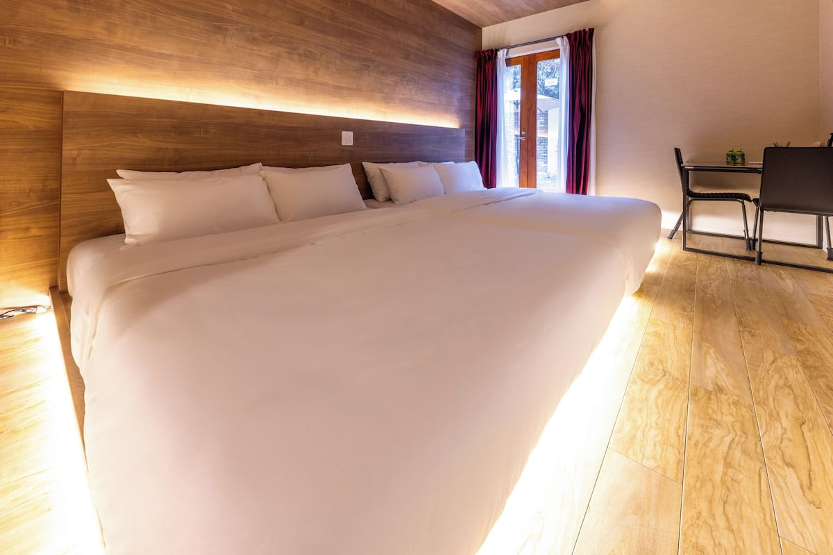 Family Quadruple Room, Garden View | Premium bedding, down comforters, Select Comfort beds, in-room safe