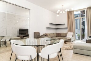 Superior Apartment, Balcony | Dining room - Cozy Chic 2BR - Pool Gym Access - JVC (Dubai)