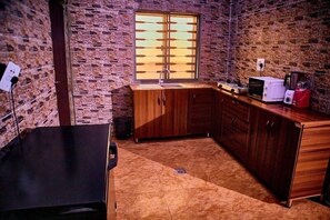 Economy Apartment, Balcony, City View | Private kitchen | Fridge, microwave, oven, stovetop