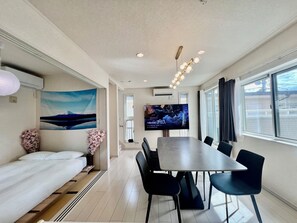 Luxury Villa, Balcony, City View | Living area | 75-inch LED TV with cable channels - COREHOTEL Ikebukuro (Tokyo)
