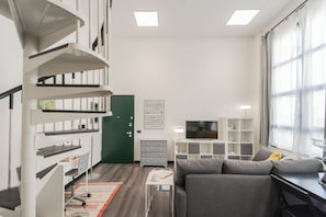 Apartment (1 Bedroom) | Living area | 32-inch TV with cable channels
