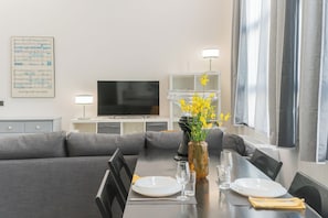 Apartment (1 Bedroom) | Living area | 32-inch TV with cable channels