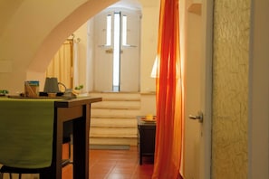 Family Quadruple Room | Living area | 30-inch flat-screen TV with digital channels