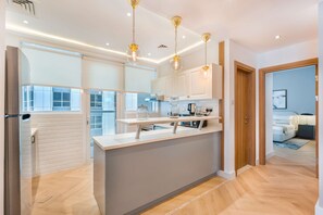 Luxury Apartment, City View | Private kitchen | Full-size fridge, microwave, oven, stovetop