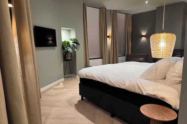 Habitació quàdruple Deluxe | Cortines opaques, habitacions insonoritzades i wifi gratuïta