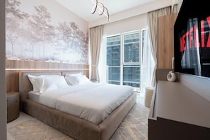 Appartement Deluxe, balcon, vue sur la mer | Literie de qualité, lit avec matelas en mousse à mémoire, coffre-fort