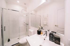 Shower, hair dryer, towels, soap