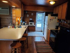 Coffee/tea maker, fridge, microwave, oven