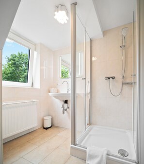 Shower, eco-friendly toiletries, hair dryer, towels