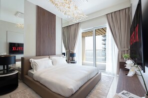 Deluxe Apartment, Balcony, Sea View | Living area | 125-cm flat-screen TV with digital channels, Netflix, streaming services - KeyRock - Grand Bleu Escape  (Dubai)