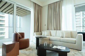 Deluxe Apartment, Balcony, Sea View | Living area | 125-cm flat-screen TV with digital channels, Netflix, streaming services - KeyRock - Grand Bleu Escape  (Dubai)