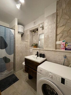 Shower, hair dryer, towels, soap