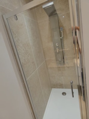 Shower, towels, soap, toilet paper