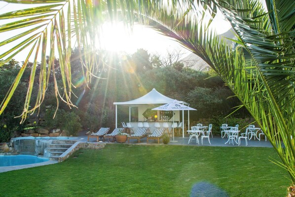 Outdoor pool, pool umbrellas, pool loungers