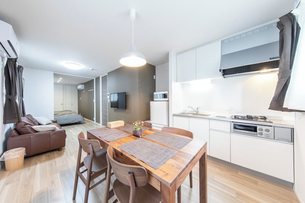 Logement Aile Room 201 - 1LDK, Non-Smoking (Warm Brown-Toned Apartment) | Bathroom | Combined shower/tub, free toiletries, hair dryer, slippers