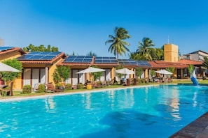 Outdoor pool, open 8:00 AM to 8:00 PM, pool umbrellas, pool loungers
