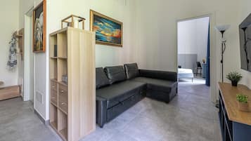 Deluxe Apartment, Balcony | Living area | 30-inch TV with satellite channels