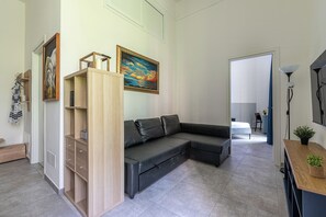 Deluxe Apartment, Balcony | Living area | 30-inch TV with satellite channels