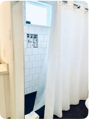 Shower, hair dryer, towels, soap