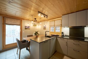 Fridge, dishwasher, coffee/tea maker, cookware/dishes/utensils