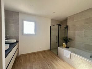 Shower, hair dryer, towels, soap