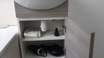 Hair dryer, towels, soap, toilet paper