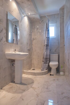 Apartment, 1 Bedroom, Balcony, Partial Sea View | Bathroom | Shower, towels, soap, toilet paper