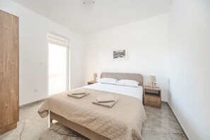 Apartment, 2 Bedrooms, Balcony, Sea View | In-room safe, desk, laptop workspace, free WiFi