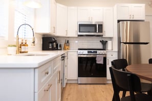 Fridge, oven, dishwasher, coffee/tea maker