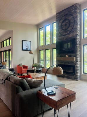 Smart TV, fireplace, table football, books