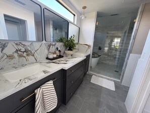 Shower, hair dryer, towels, soap