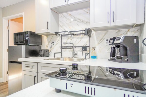 Fridge, microwave, stovetop, coffee/tea maker