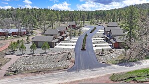 A residential area with houses arranged in a semi-circular pattern around a central road. - Throttle Down in Style A Biker s Dream Stay (Rapid City)