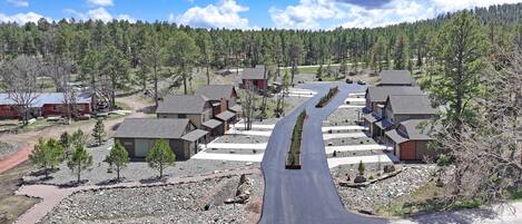 A residential area with houses arranged in a semi-circular pattern around a central road.
