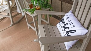 A wooden bench with a cushion that reads "BROOKLINE."