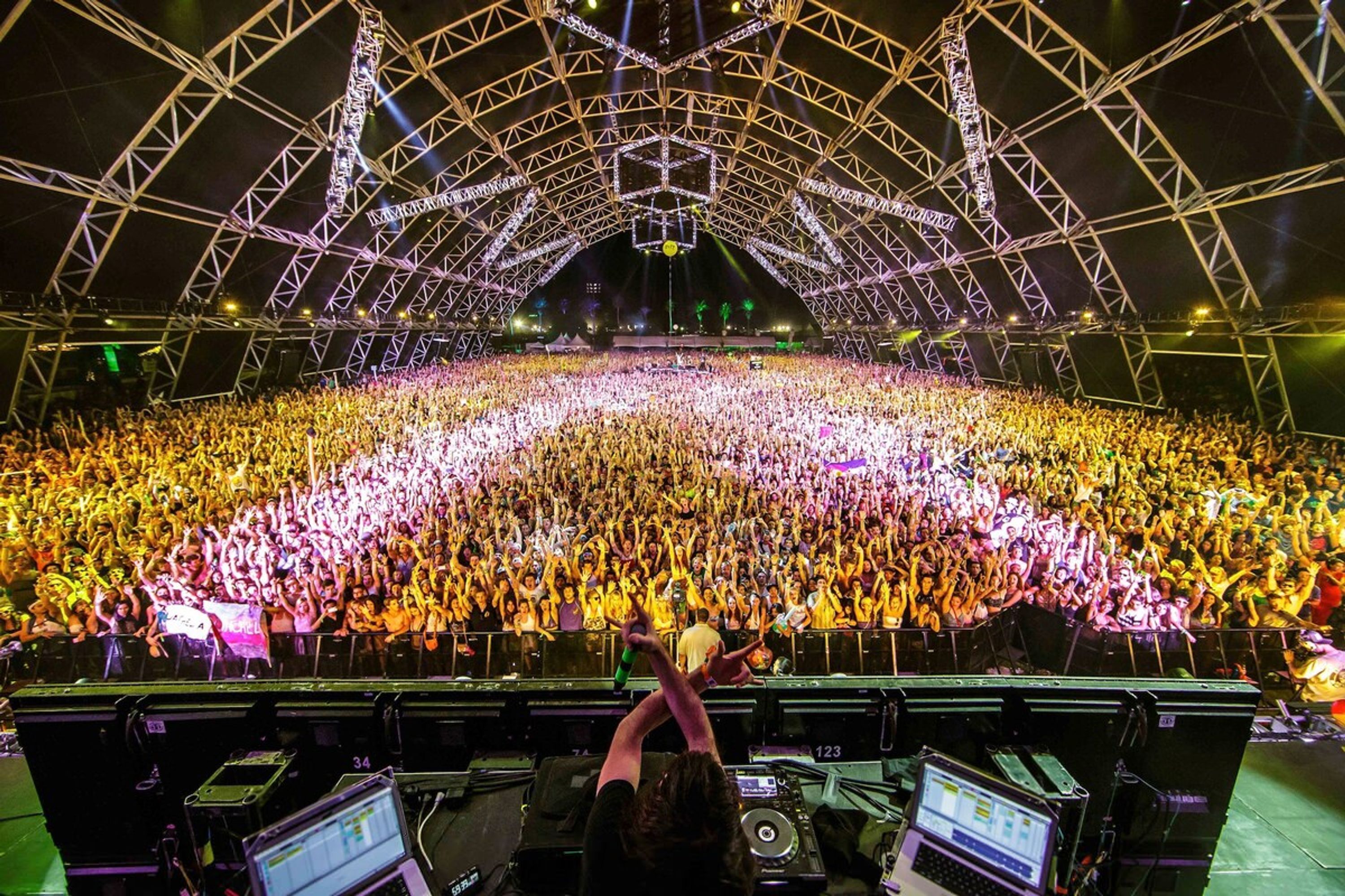 A large indoor venue with a high ceiling and a stage at the front.
