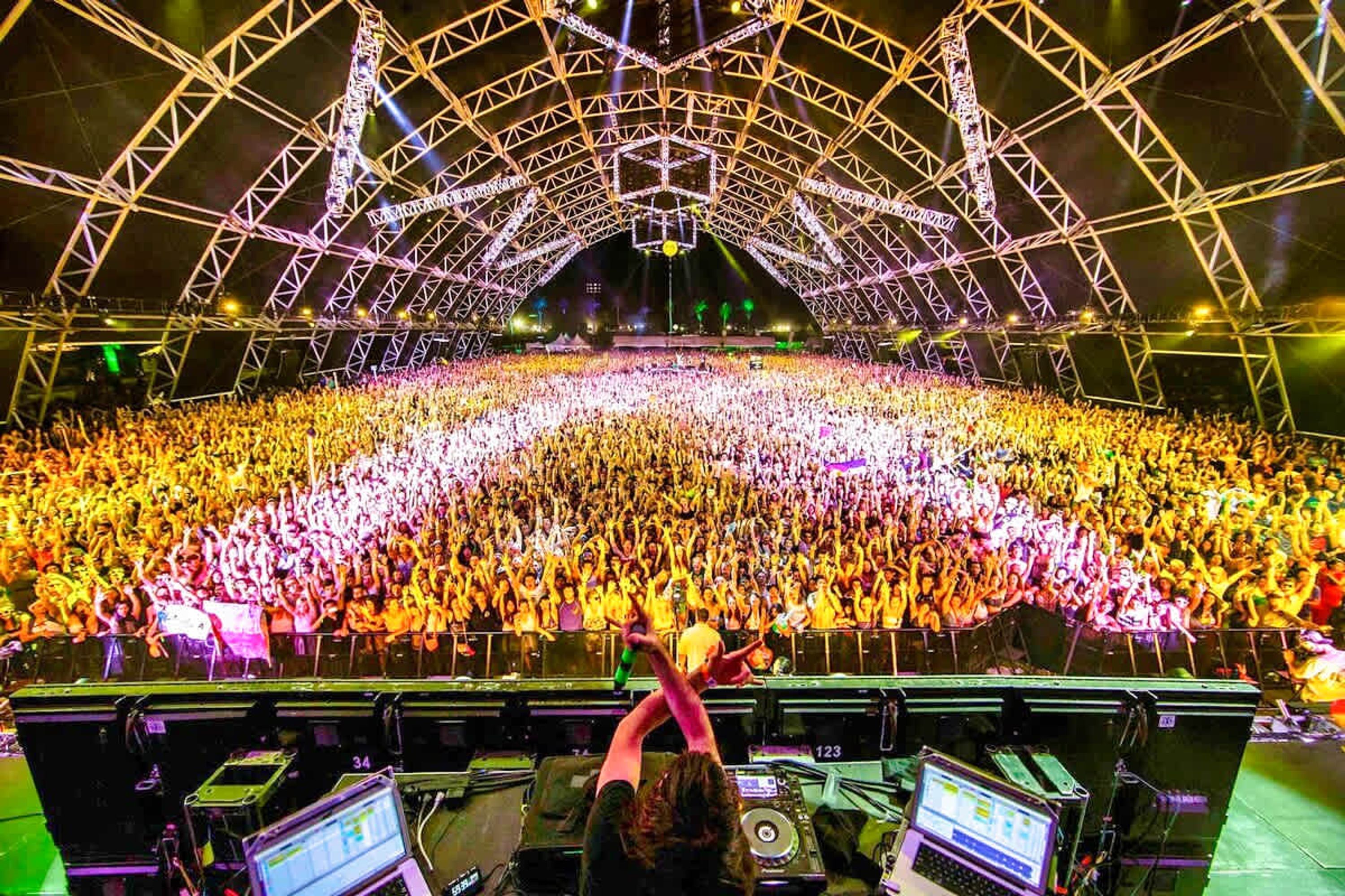 A large indoor venue with a high ceiling and a stage at the front.