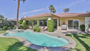 A house with a swimming pool, a patio with lounge chairs, and a covered grill area. - 5 Star Rating Oasis Golf Pool Spa 3bed Pga West (La Quinta)