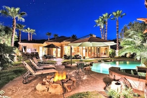 A resort with a swimming pool, outdoor seating, and a fire pit. - Casa Riviera 5BR PGA West Estate Pool Fire Pit (La Quinta)