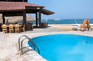 Outdoor pool, pool umbrellas, pool loungers