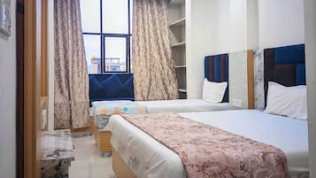 Deluxe Triple Room, City View | Desk, laptop workspace, free WiFi