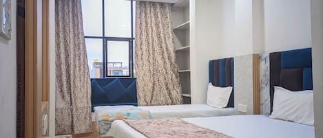 Family Room, City View | Desk, laptop workspace, free WiFi